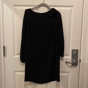 Black dress   Bow detail on shoulder. Sheer sleeves.